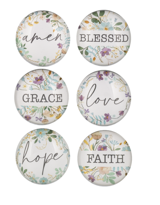 Set of six circular magnets with motivational phrases and floral designs.