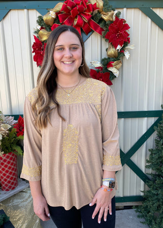 Bubbly Gold Top	Bubbly gold top – champagne colored puff sleeve blouse with shimmer fabric and festive style