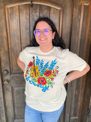 Bluebonnet Howdy Tee - Our Howdy Floral Guitar Tee is bursting with the beauty of Texas wildflowers — bluebonnets, Indian paintbrushes, and bright blooms that feel like home.