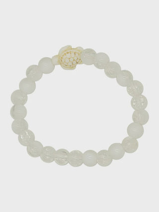 White beaded bracelet with a floral clasp on a white background