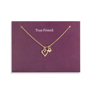 Gold necklace with heart pendants on a purple card with 'True Friend' 