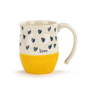 Mug with blue heart patterns and 'love' text on a white background