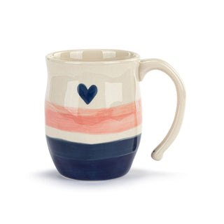 Ceramic mug with a heart design on a white background