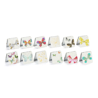 Set of butterfly-themed coasters on a white background
