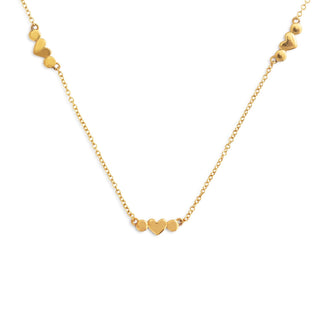 Gold necklace with heart-shaped pendants on a white background