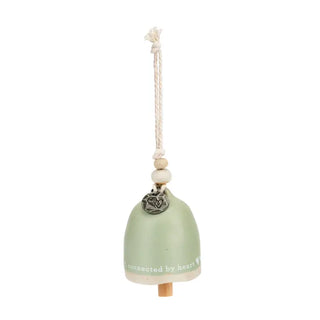 Decorative bell for sisters with a rope and wooden base on a white background