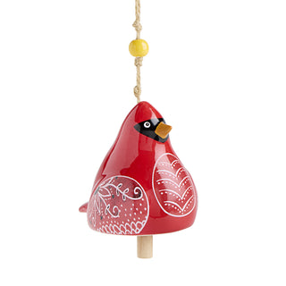 Red bird-shaped ornament with white patterns on a white background