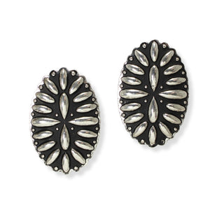 Pair of vintage-style oval silver stud earrings featuring a raised silver-tone blossom motif against an oxidized black background with a beaded scalloped edge, displayed on a plain white background.