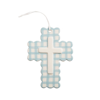 Decorative cross with blue and white checkered pattern on a white background