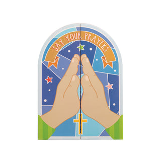 Book with praying hands and 'Say Your Prayers' text on a colorful background