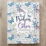Coloring book titled 'The Psalms Color' on a wooden surface