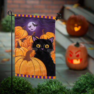 Halloween-themed garden flag with a black cat and pumpkins