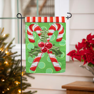 Christmas themed garden flag with candy canes and mistletoe
