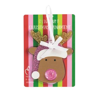 A light-up reindeer Christmas ornament with gold glitter antlers, a pink glitter Santa hat, and a pink glitter nose, attached to its original packaging.