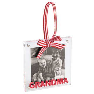 A square acrylic photo frame ornament labeled "GRANDMA" in red lettering, featuring a red-and-white striped hanging ribbon and bow.