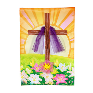 Decorative cross with purple fabric against a colorful sun and floral background