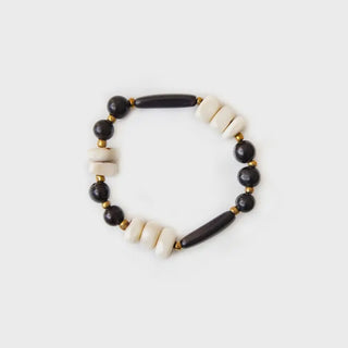 Bracelet with black and white beads on a light gray background