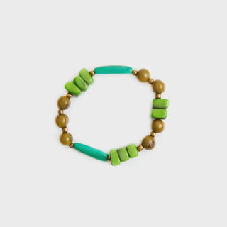 Bracelet with green and brown beads on a white background
