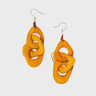 Pair of orange earrings on a white background