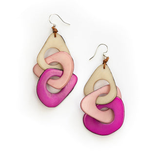 Colorful interlocking teardrop earrings on a white background