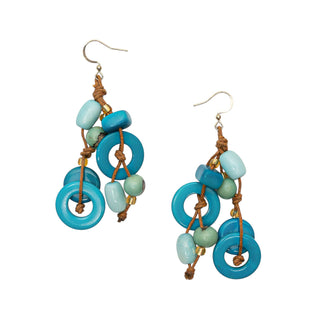 Pair of earrings with blue and green circular beads on a white background