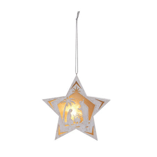 A white star-shaped nativity ornament with a lit depiction of the nativity scene in the center, hanging by a string.