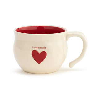White soup mug with red interior and heart design and homemade on a white background