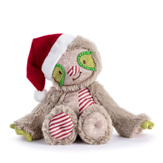 A plush toy sloth wearing a red and white Santa hat and red-and-white striped clothing, photographed on a clean white background.