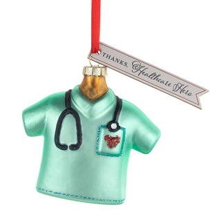Ornament shaped like a medical scrub top with stethoscope and 'Thanks, Healthcare Hero' tag 