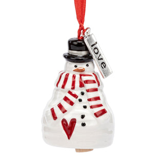 Snowman ornament with red scarf, black top hat, and 'love' tag 