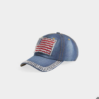 Denim cap with American flag design and rhinestone embellishments on a light gray background