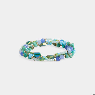 Multicolored beaded bracelet on a light gray background