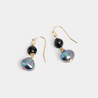 A pair of gold-tone fish hook drop earrings, each featuring a small faceted round bead above a larger rounded iridescent pearl-style bead, shown in the Pearly White colorway against a white background.