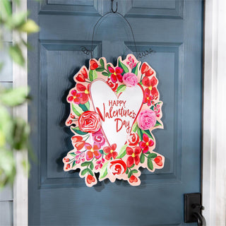Decorative sign with floral design and 'Happy Valentine's Day' text on a blue door.
