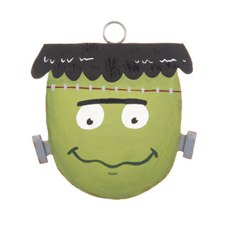 Green monster face Round Top Charm with black hair and white eyes on a white background