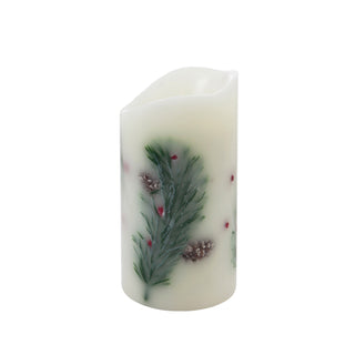 Decorative candle with green leaf and red berry design on a white background