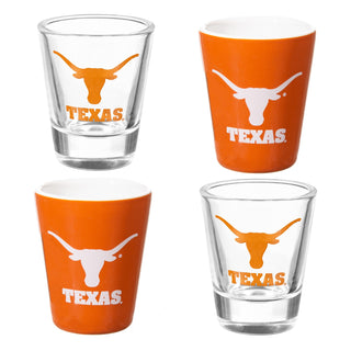 Set of four shot glasses and tumblers with 'Texas' and longhorn logo on a white background