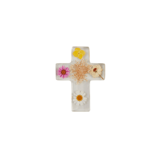 Dried and preserved flowers within clear resin cross.