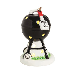 Black barbecue ornament with 'Grill & Chill' sign on a white background