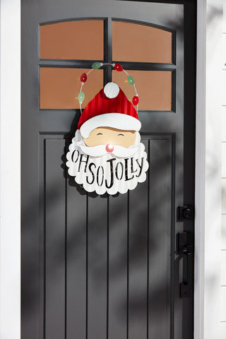 Decorative sign with Santa face and 'Oh So Jolly' text