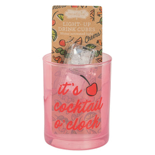 Pink container with 'it's cocktail o'clock' text, light-up drink cubes, and Mudpie packaging on a white background.