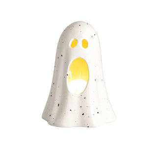 White ghost-shaped votive
