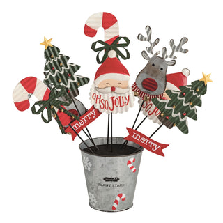Decorative Christmas plant stake set with Santa, reindeer, and trees in a metal pot.