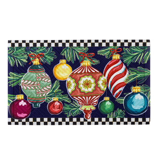 Decorative mat with colorful Christmas ornaments and greenery on a checkered border.