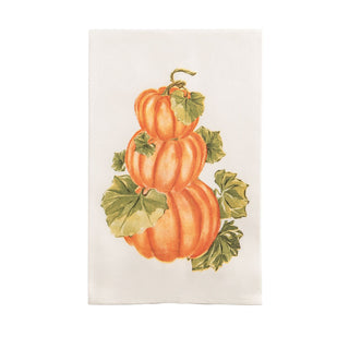 White dish towel with a stack of pumpkins