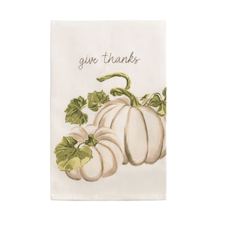 White kitchen towel with white pumpkins and green leaves and 'give thanks' text 