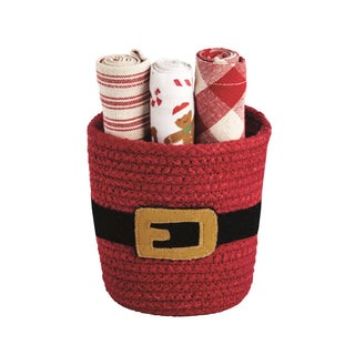 Red woven basket with a belt buckle holding rolled-up towels on a white background