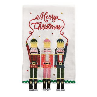 Decorative towel with Christmas-themed nutcrackers and 'Merry Christmas'