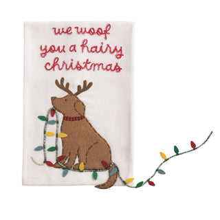 Embroidered towel with a dog wearing reindeer antlers and lights, and text 'we woof you a hairy Christmas' on a white background.