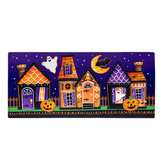 Halloween-themed design with houses, pumpkins, and ghosts on a purple background